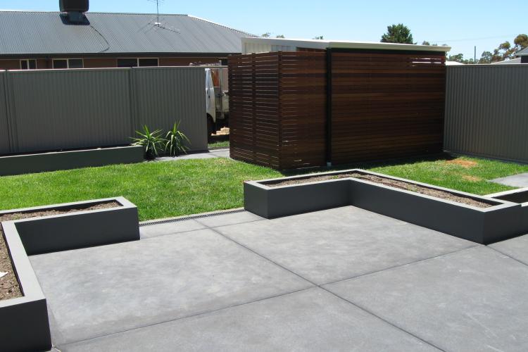 Robert concreted the back yard floor and plantar boxes.